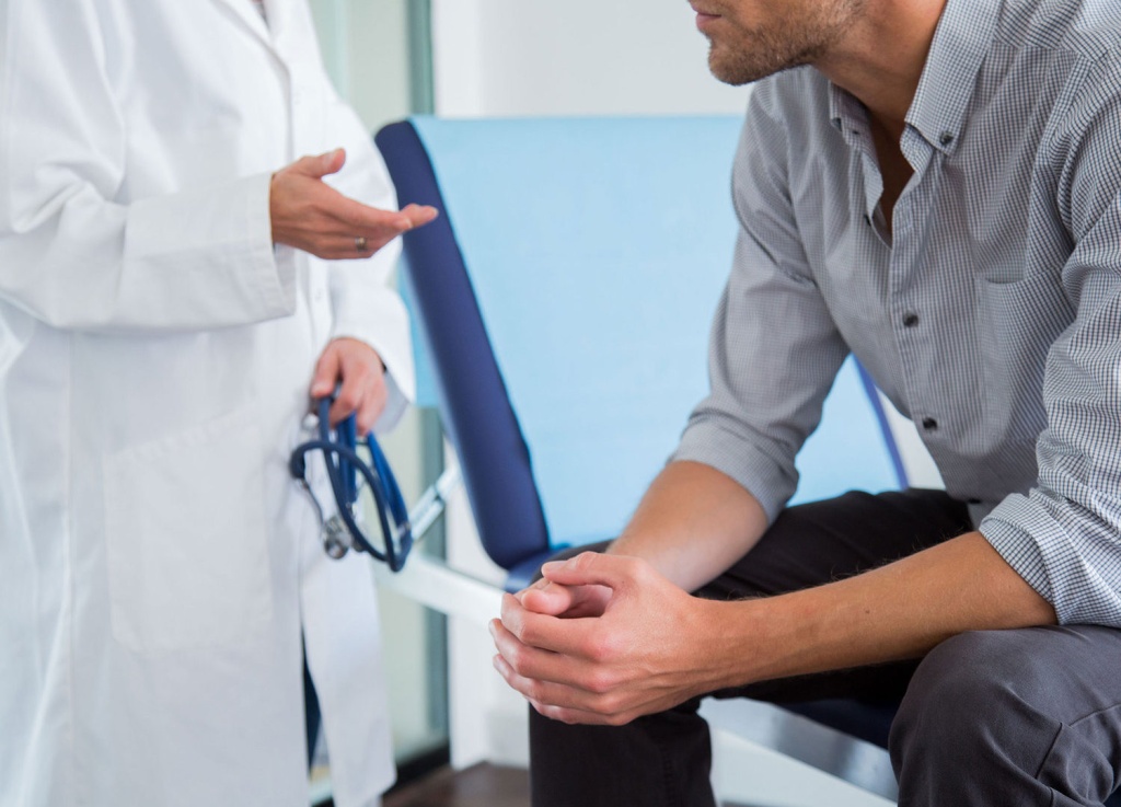 Man reading in a quiet, well-lit space at home